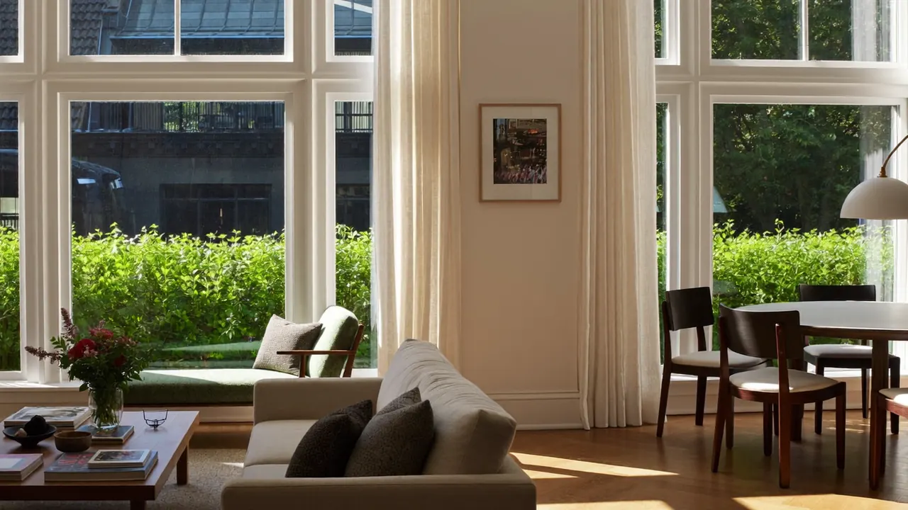 Modern tilt-and-turn window opened inward in a bright room