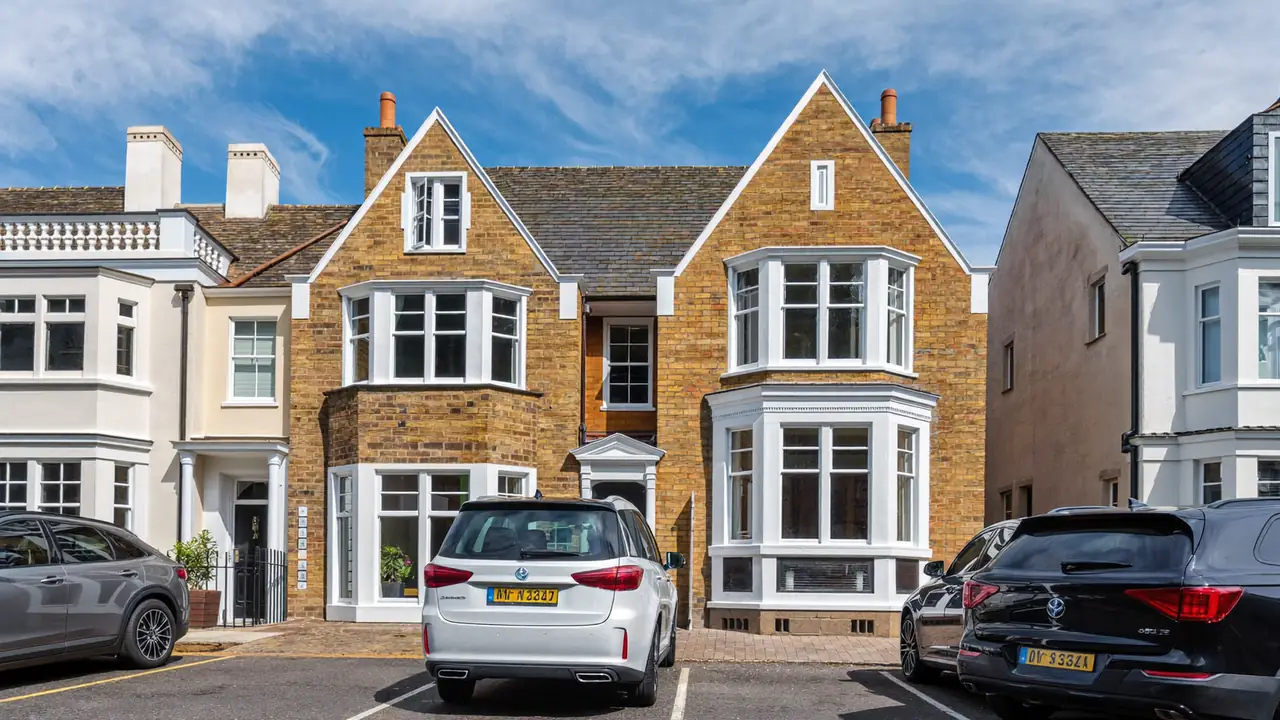 Terraced house frontage with newly installed double glazed windows